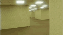 a very long hallway with a lot of empty walls and carpet .