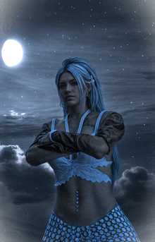 a woman with blue hair stands with her arms crossed in front of the moon