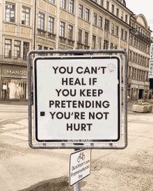 a sign that says " you can t heal if you keep pretending you 're not hurt "