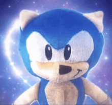 a stuffed sonic the hedgehog with a blue background