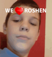 a boy with a heart on his forehead and the words we roshen