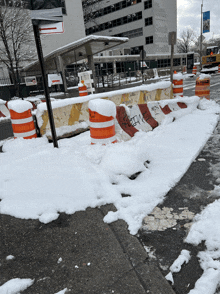 a snowy sidewalk in front of a south brook health building