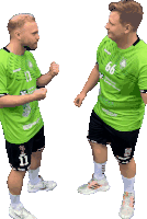 two men wearing green shirts with the number 11 and 66 on them