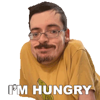 a man wearing glasses and a yellow shirt that says i 'm hungry on it