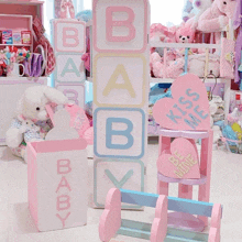 a room with a pink chair that says " kiss me " on it