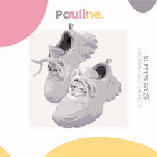 a pair of white sneakers with the words pauline on the top