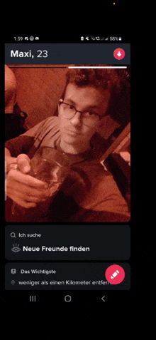 a phone screen shows a man holding a glass and the name maxi