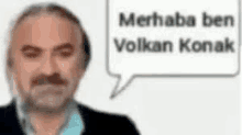 a man with a beard and a speech bubble that says merhaba ben volkan konak