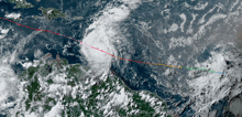 a satellite image of a tropical cyclone with a red and green line