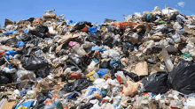 a pile of garbage including plastic bags and bottles