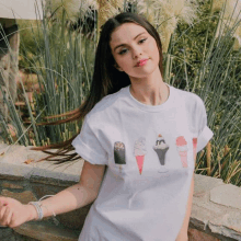 a woman wearing a white t-shirt with ice cream images on it