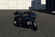 a black motorcycle is parked on a gravel road