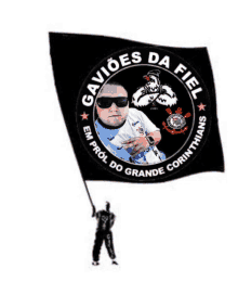 a picture of a man holding a black flag that says gavioes da fiel