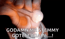 a close up of a person 's hand with the words goddamn mr stemmy gotem again !