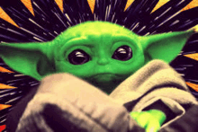 a baby yoda from star wars is wrapped in a blanket with a starry background .