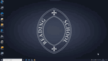 a computer screen shows a reading school logo in a circle