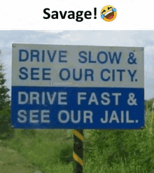 a sign that says savage drive slow & see our city drive fast & see our jail .