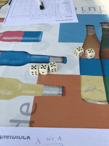 a table with bottles and dice on it and a piece of paper that says x n.a.