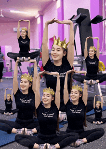 a group of girls wearing black shirts with the word " feng " on it