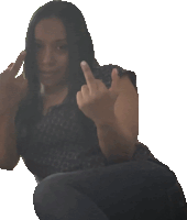 a woman giving the middle finger while sitting down