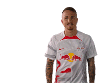 a man in a white shirt with red bulls on it