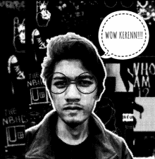 a black and white photo of a man with glasses and a speech bubble that says wow kerenn !!