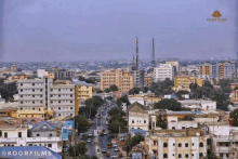 an aerial view of a city with a sign that says koorfilms