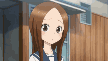 a cartoon girl with long brown hair is standing in front of a wooden wall