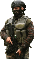 a soldier wearing a mask and helmet holds a rifle