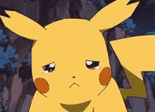 a close up of a pikachu cartoon character with a sad look on his face .