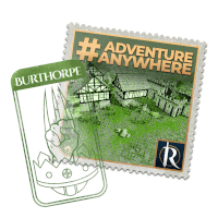 a stamp that says adventure anywhere next to a sticker