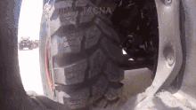 a close up of a tire that says tacna on the side