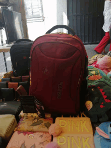 a red polo king backpack sits on a table