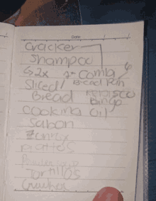 a notebook is open to a list of items including cracker shampoo