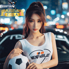 a woman holding a soccer ball with the word mixparlay on her shirt