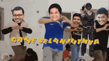 a group of men are dancing in front of a sign that says game selanjutnya