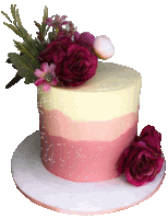 a pink and white cake with flowers and pearls on top