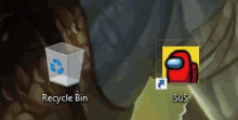 a recycle bin and an among us icon are on a computer screen .