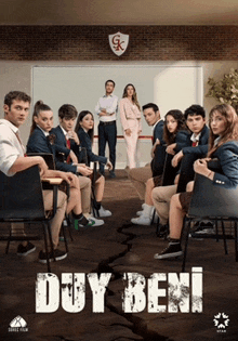 a group of people sitting in chairs in front of a whiteboard that says duy beni