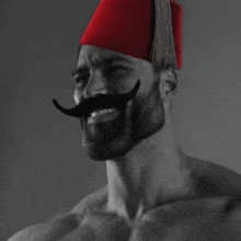 a shirtless man with a beard and mustache is wearing a red hat .