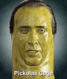 a pickle with a man 's face painted on it