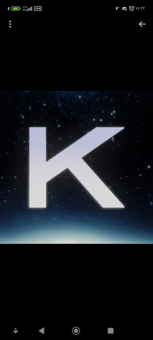 a phone screen shows the letter k in a space background