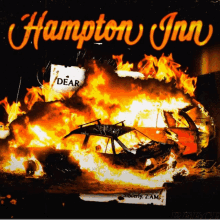 a poster for hampton inn with a burning car