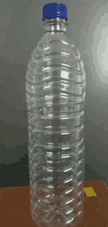 a clear plastic water bottle with a blue cap