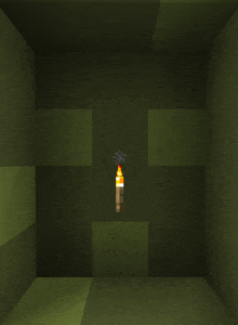 a torch is lit up in a dark room in a minecraft game