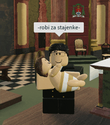 a man is holding a baby in his arms with a speech bubble that says robi za stajenke