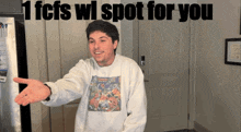 a man wearing a sweatshirt that says 1 fcs wi spot for you