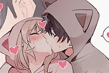 a man in a cat hoodie kisses a woman