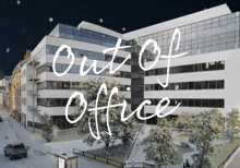 a large white building with the words out of office written in front of it