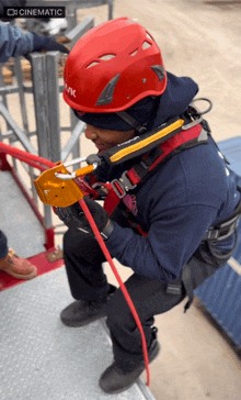 a man wearing a red helmet that says kask